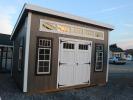 Pine Creek 10x14 Studio Lean-To with Driftwood walls, White trim, and Charcoal shingles